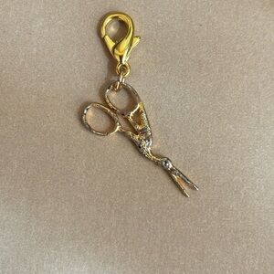 Gold color sewing charm